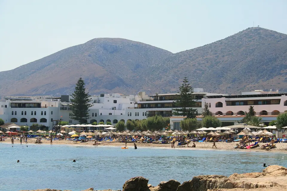 Sandy beach with umbrellas at Hersonissos on the north coast of Crete