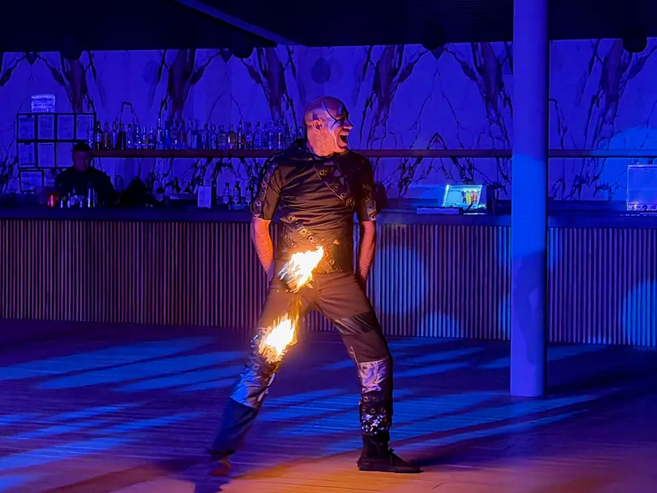 Fire dancer performing at night during a show at Hilton Cancun Mar Caribe