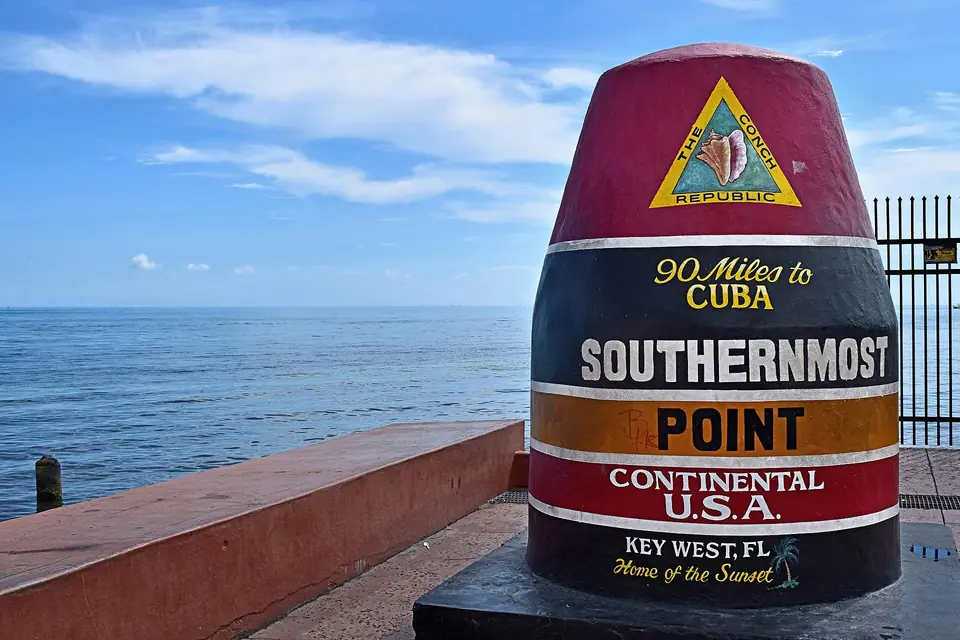 The red, black and yellow Southernmost Point buoy in Key West