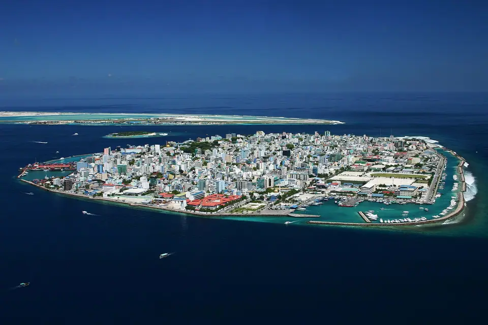 Dense skyline of Malé, capital of the Maldives, surrounded by sea