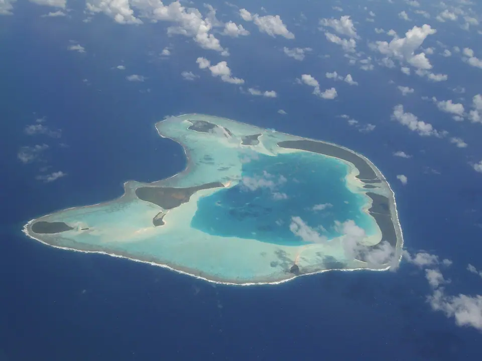 Aerial view of Tetiaroa atoll's ring of motus and lagoon