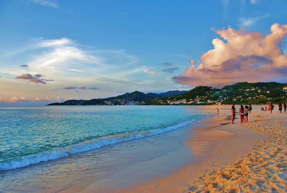 Long curve of white sand and calm water at Grand Anse Beach, Grenada