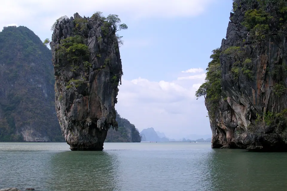 Limestone pinnacle of Koh Tapu rising from the green water of Phang Nga Bay