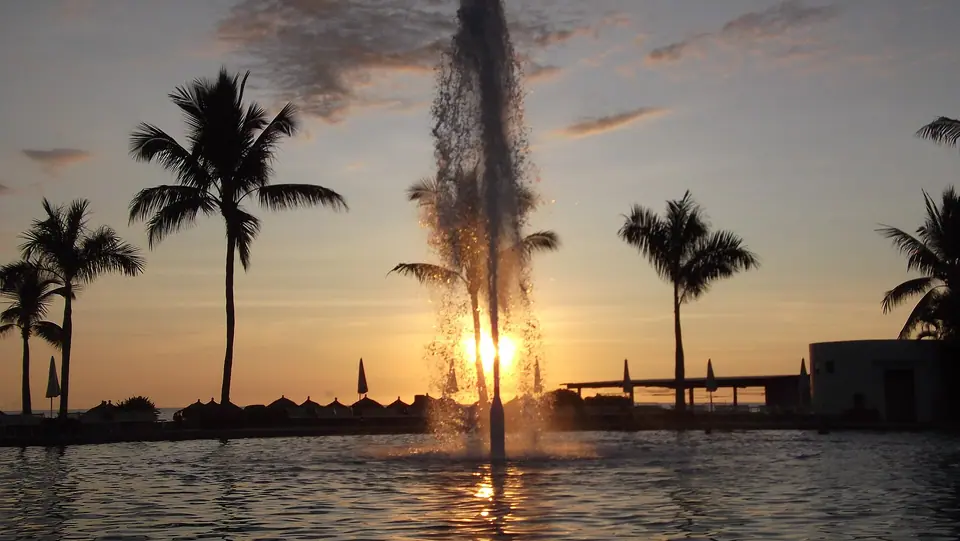 Sunset over the long flat beach at Nuevo Vallarta on Banderas Bay