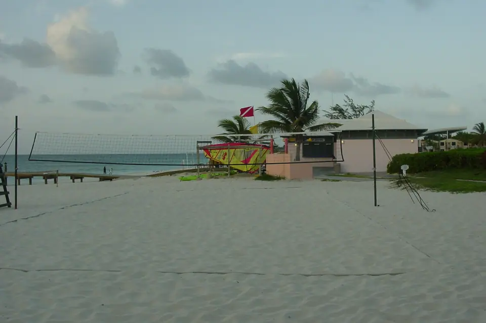 Wide white-sand beach and turquoise water in front of Beaches Turks and Caicos resort