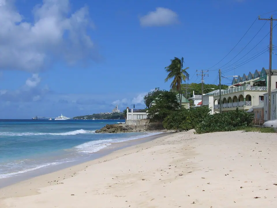 Quiet sandy beach in Speightstown on the northwest coast with buildings along the shore