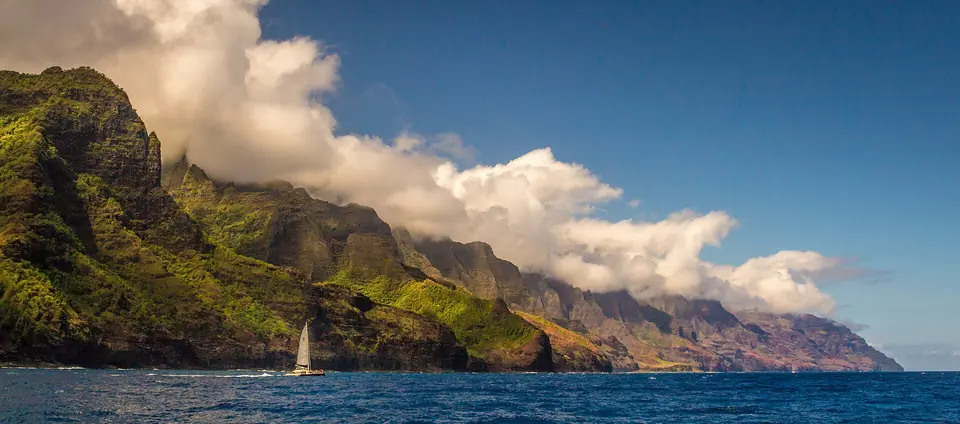 Sunlit ridges of the Na Pali Coast above the Pacific on Kauai