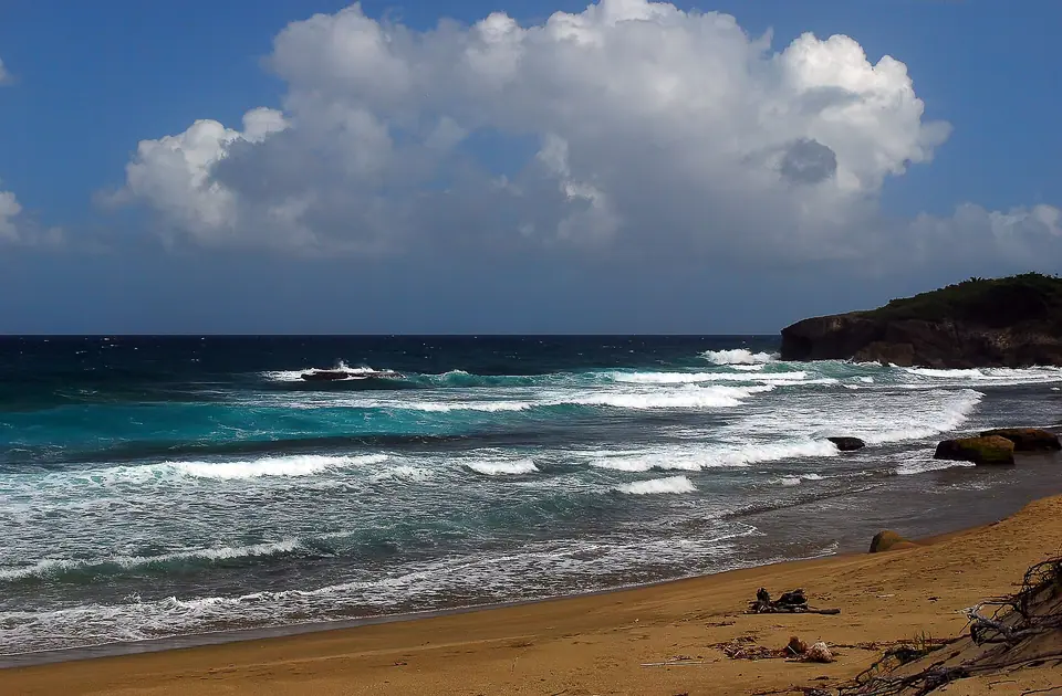 Surf beach with reef and waves at Jobos Beach on Puerto Rico's northwest coast
