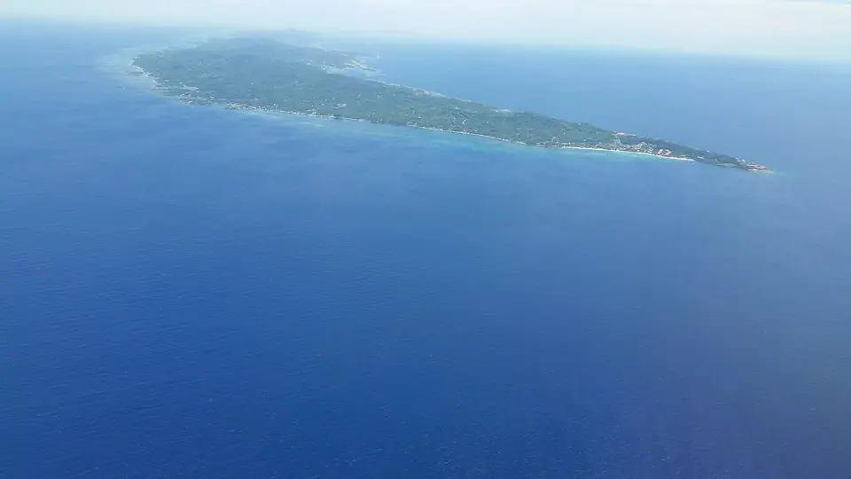 Aerial view of western Roatán with West Bay on the right and Coxen Hole and the airport in the distance