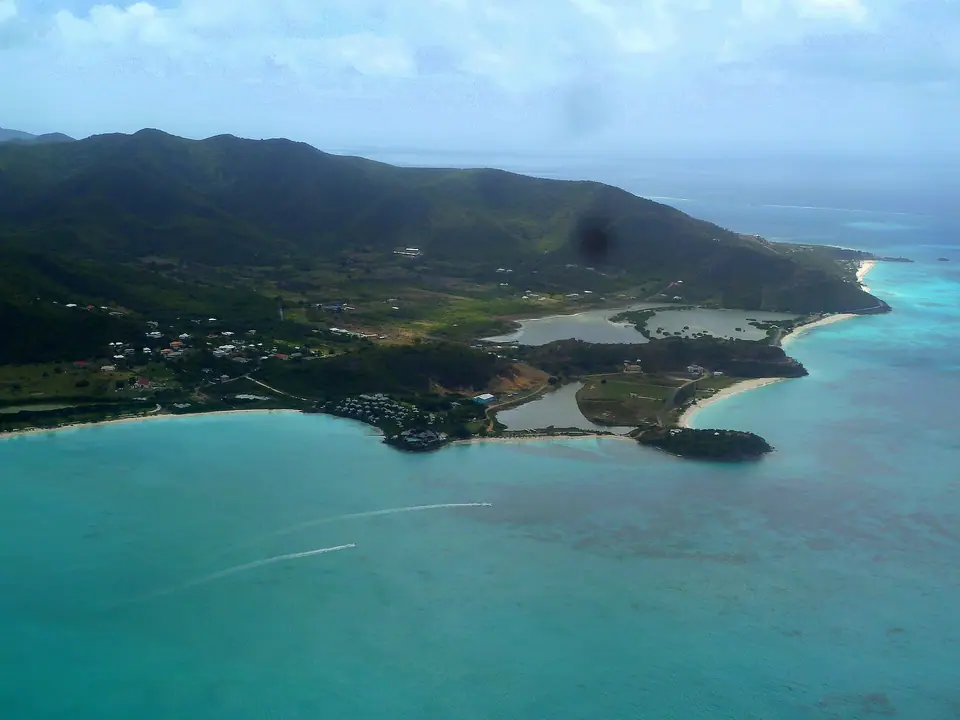 Cocobay Resort cottages on a green hillside above Valley Church Bay and Ffryes Bay