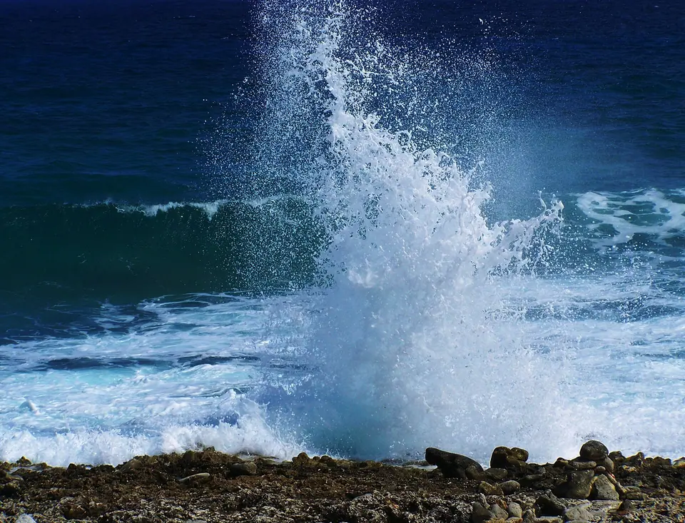 Waves spraying up through the blow holes on the rocky East End coast of Grand Cayman