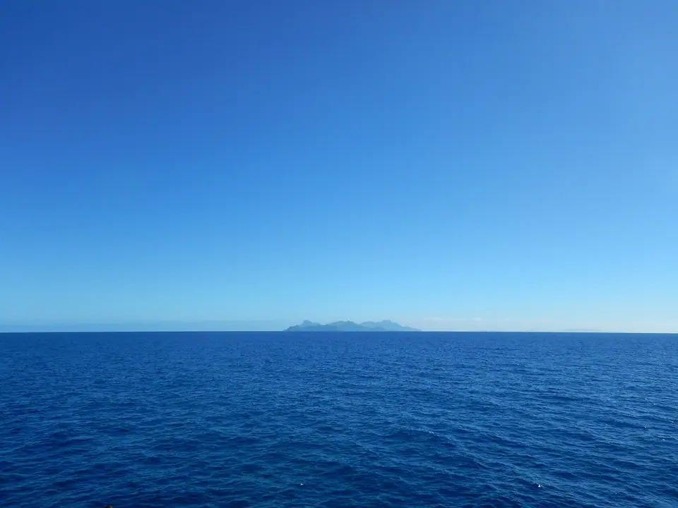 Green volcanic Yasawa Islands rising from a calm blue sea in Fiji