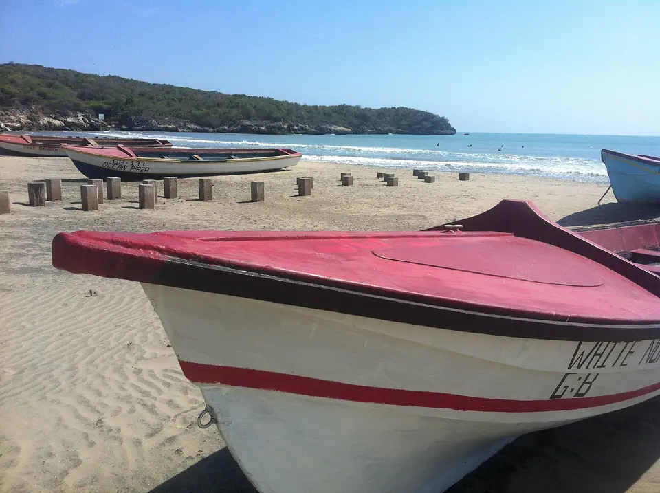 Great Bay beach at Treasure Beach on Jamaica's south coast with fishing boats on the sand