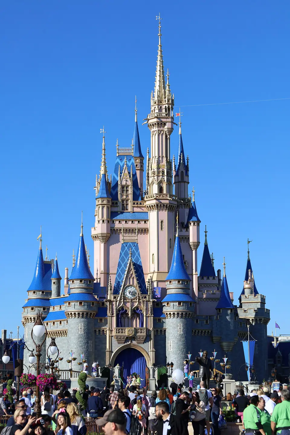 Cinderella Castle at Magic Kingdom, Walt Disney World, under a blue sky