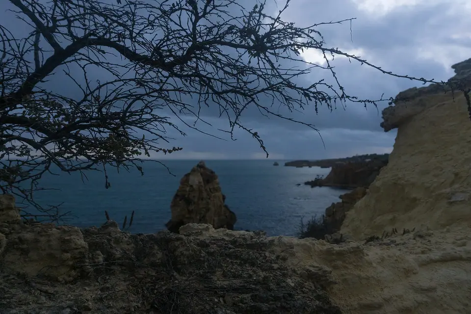 Golden sandstone cliffs and beach along the Algarve coast at Albufeira