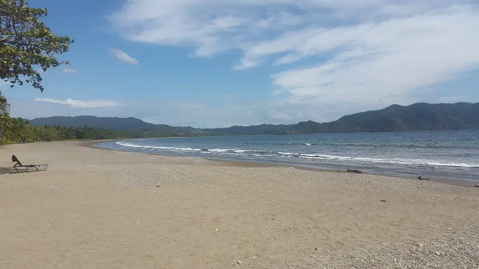 Calm bay and palm-lined sand at Playa Tambor on Costa Rica's Nicoya Peninsula