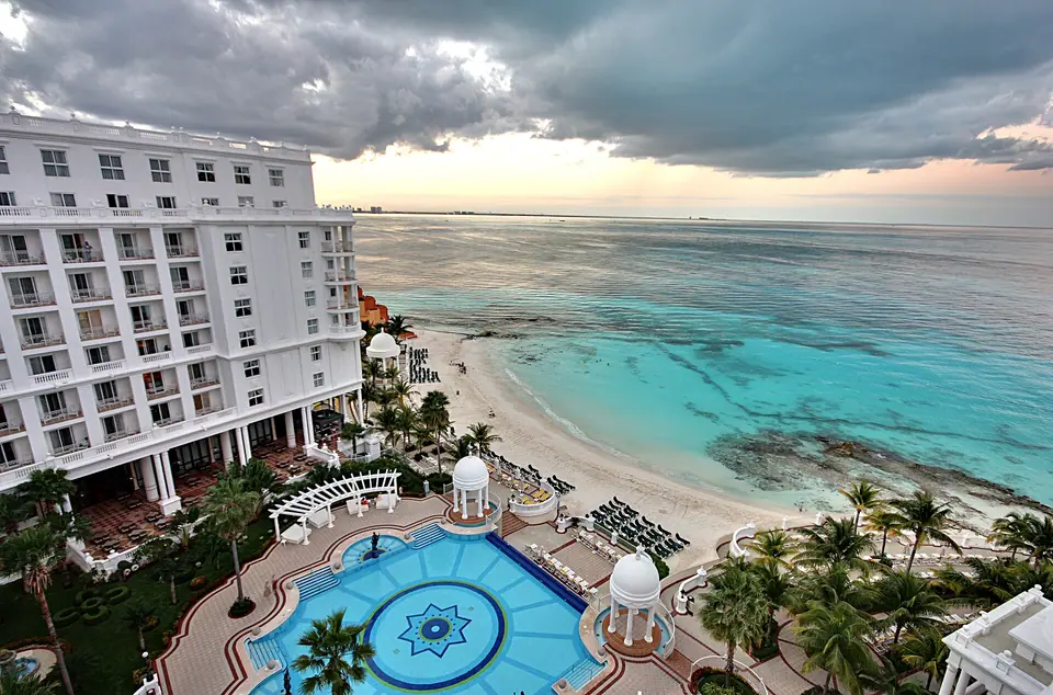 View of the turquoise Caribbean and beach from a balcony at Riu Palace Las Americas in Cancun