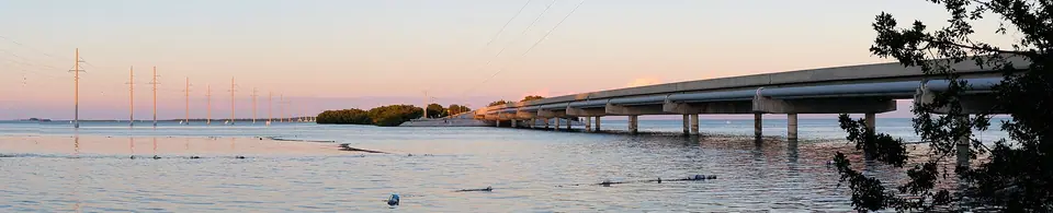The Overseas Highway at dusk stretching across the water in the Florida Keys