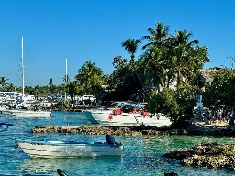 Clear water and boats along the shore at Bayahíbe on the Dominican Republic's Caribbean coast