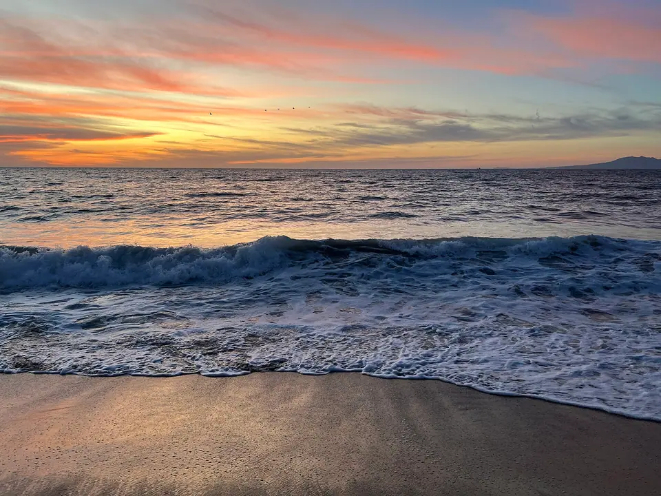 Sunset over the ocean seen from the Zona Romantica waterfront in Puerto Vallarta