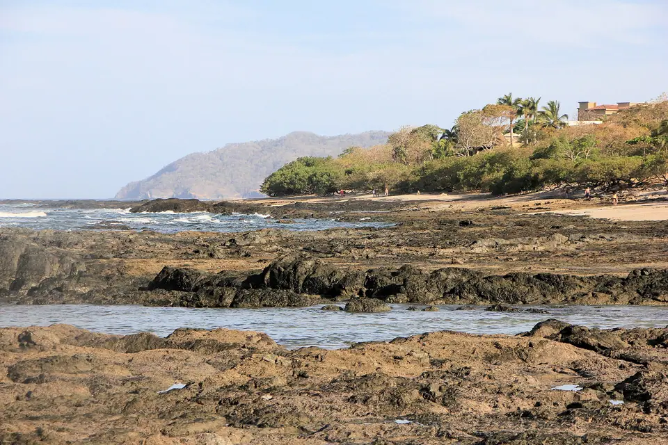 Waves and rocky shoreline at Playa Langosta near Tamarindo, Costa Rica