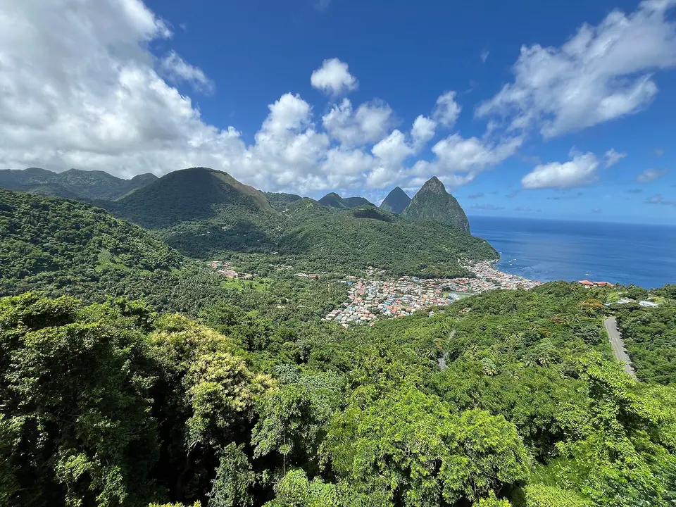 The twin Pitons rising above Soufrière town and its bay in St. Lucia