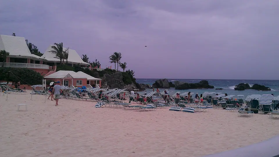Large pink Fairmont Southampton resort building on a hill above Bermuda's South Shore