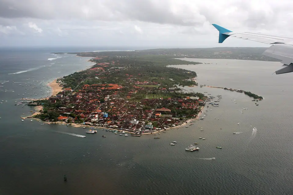 Tanjung Benoa peninsula in Bali with boats offshore and Nusa Dua in the background