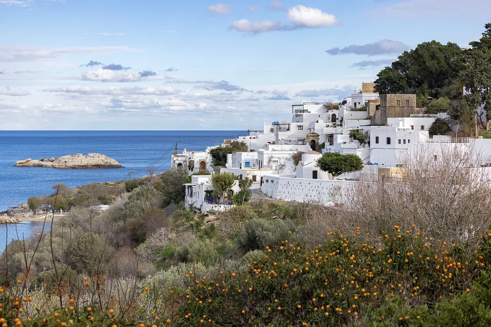 White houses of Lindos village on Rhodes below the hilltop acropolis