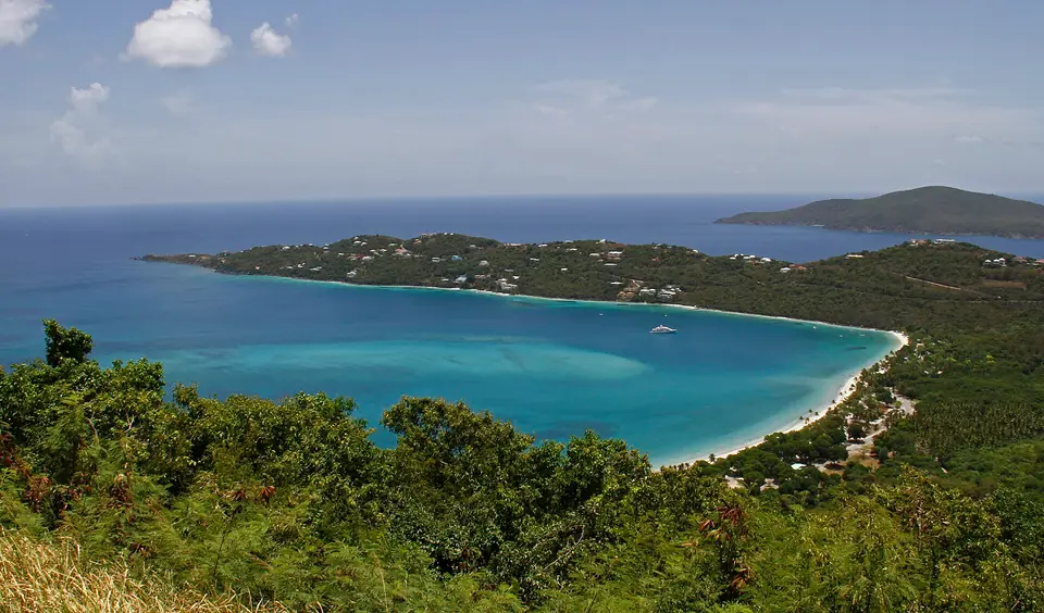 Calm turquoise water and a curving white-sand beach at Magens Bay on St. Thomas