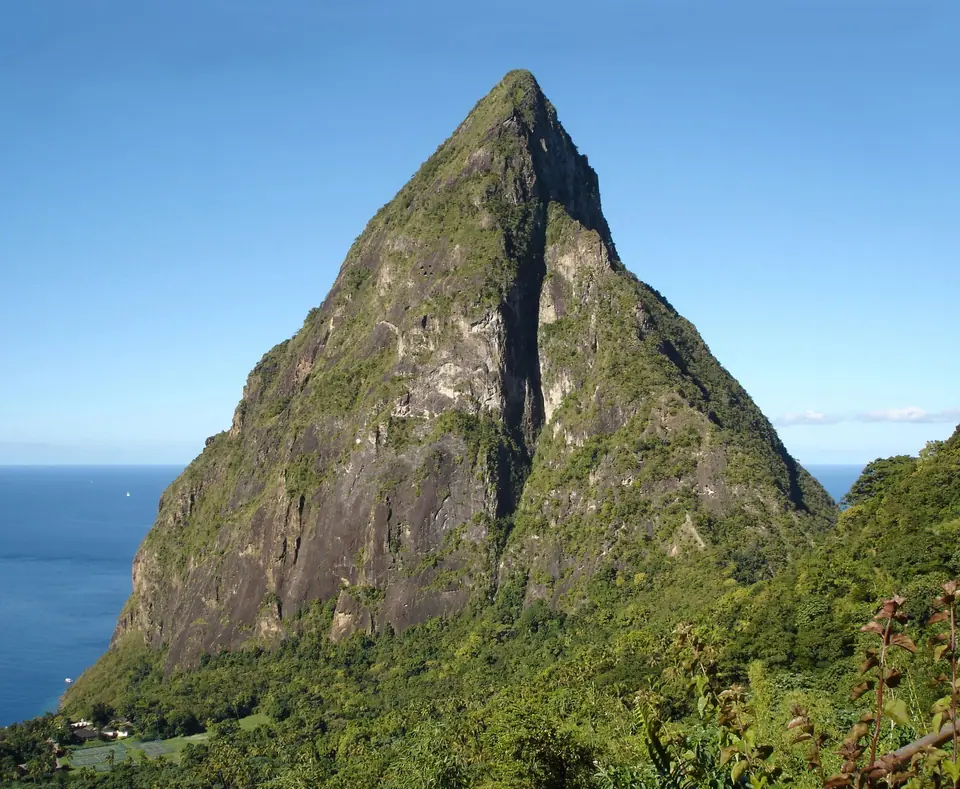 Petit Piton rising above the sea in St. Lucia seen from a hillside restaurant