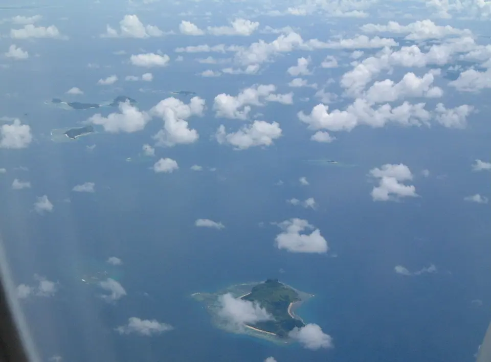 Small green islands and reefs of the Mamanuca group in Fiji seen from the air