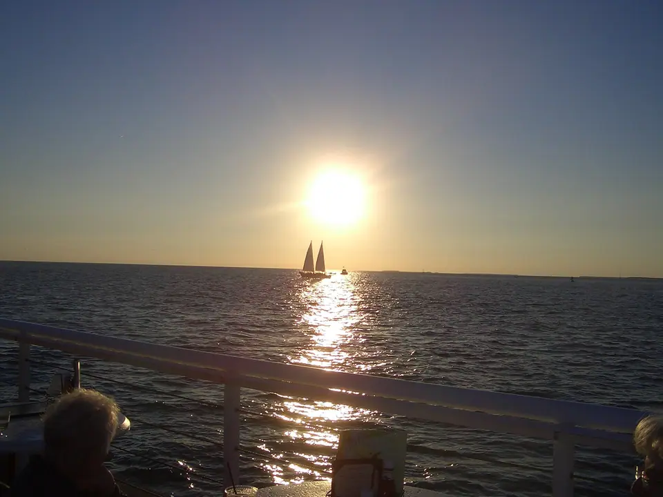 The sun setting over the water from Mallory Square in Key West