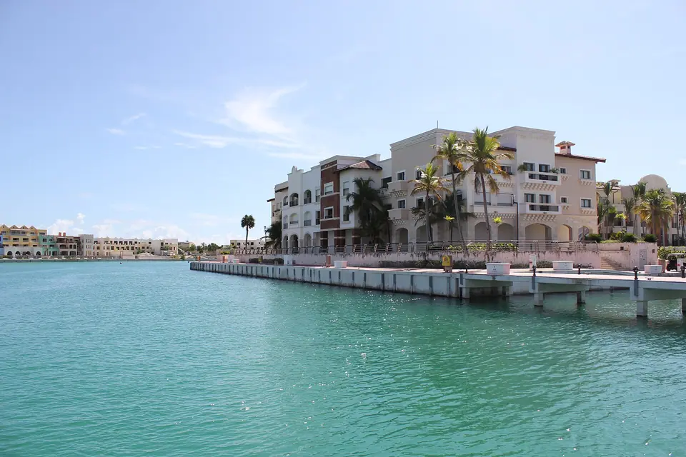 Yachts and motorboats moored in the marina at Cap Cana under a blue sky