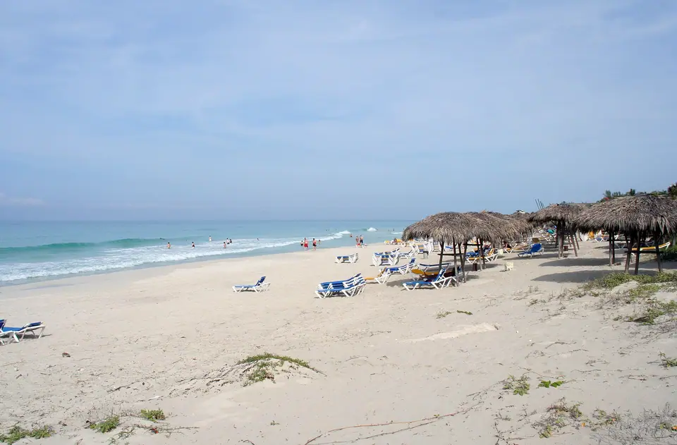 Wide pale-sand Varadero beach in Cuba with clear shallow water