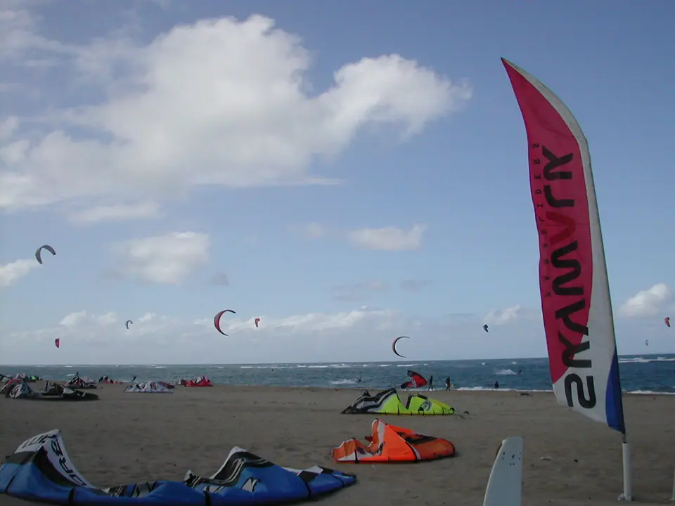 Kitesurfers and colorful kites over the water at Kite Beach in Cabarete