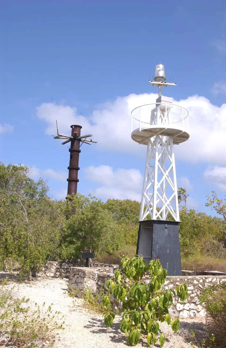 White East End lighthouse at Gorling Bluff on Grand Cayman under a blue sky