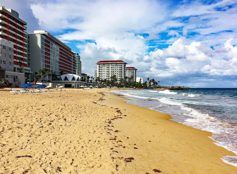 Condado Beach in San Juan with La Concha hotel on the left and the Condado Vanderbilt in the distance